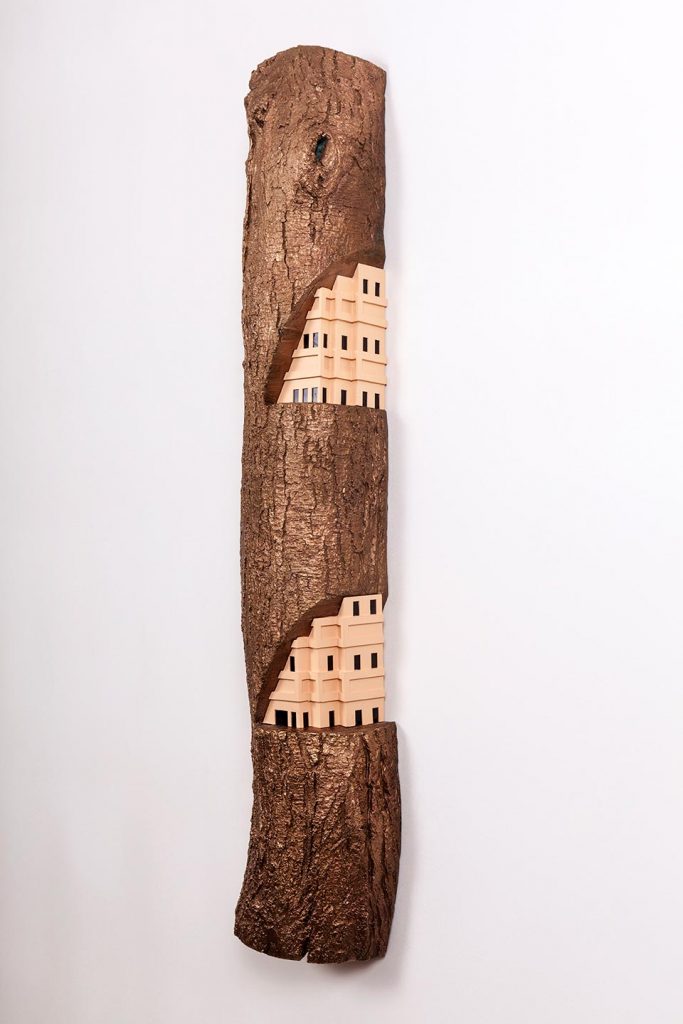 A city carved into a piece of wood