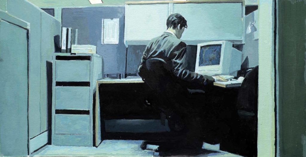 Neo at his computer in his office cubicle