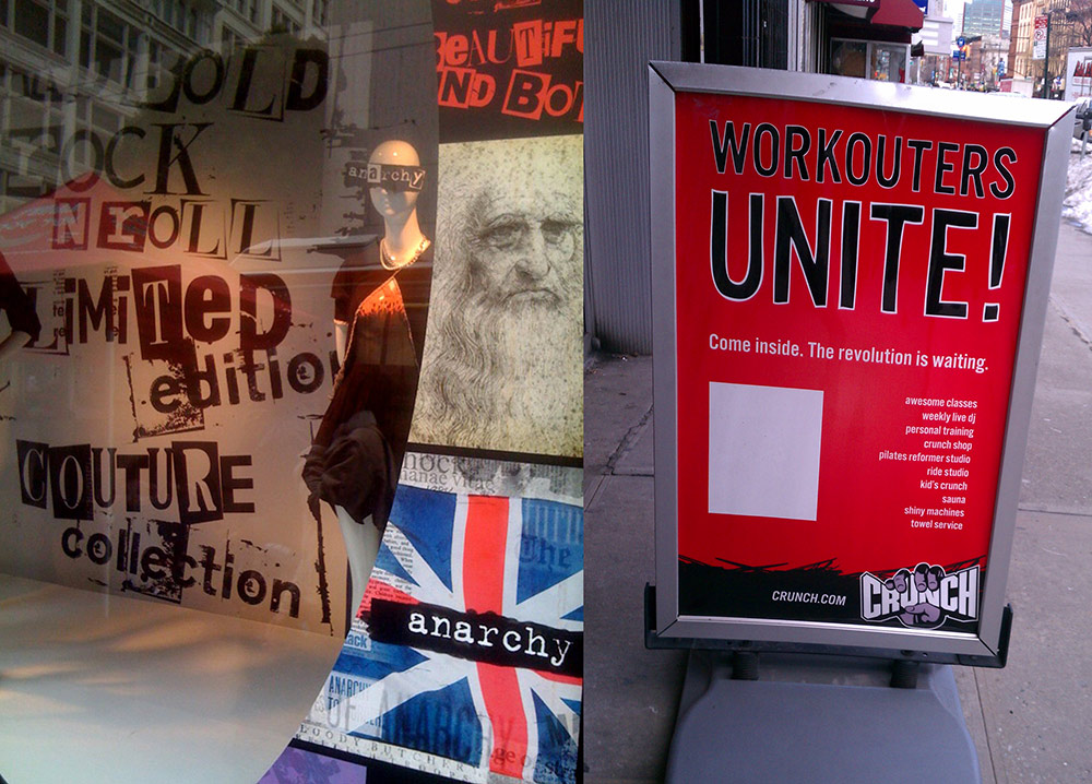 An anarchy-themed shop window in New York City, 2011 and a "revolutionary" workout offer, Brooklyn, New York, 2011.