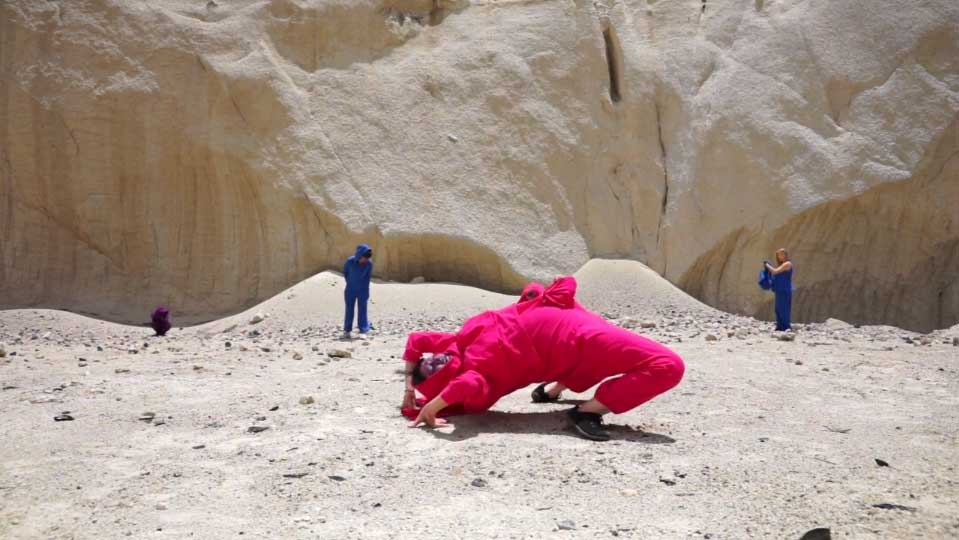 a person doing a backbend in a quarry