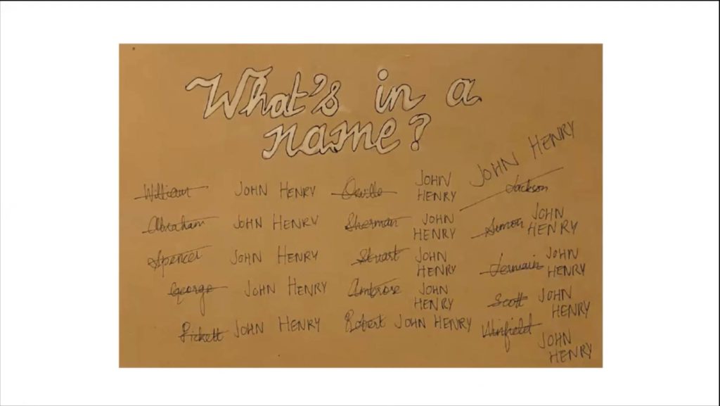 a card covered in names crossed out with John Henry written in